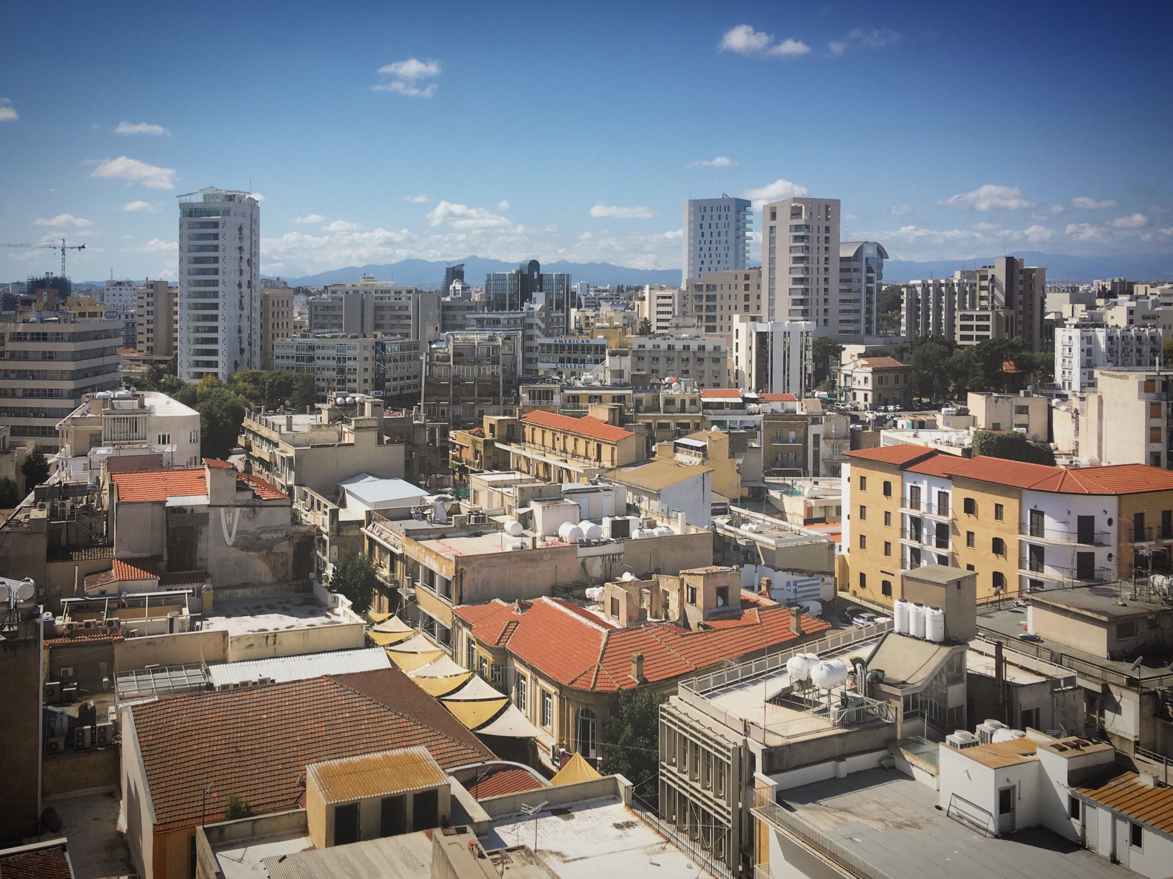 Skyline view of Nicosia's diverse architecture under a clear blue sky.